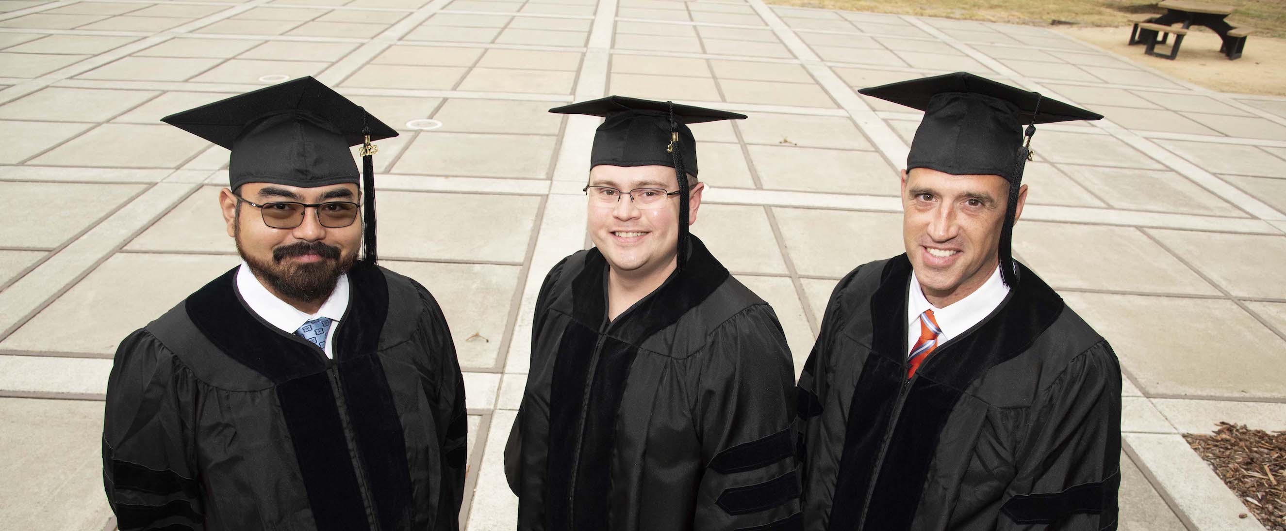 A group of NPS newly graduates posing for a photo