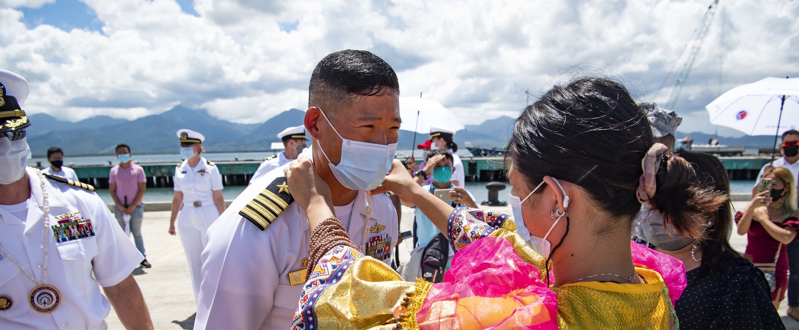 Capt. Hank Kim is greeted upon arrival to Puerto Princesa during a Pacific Partnership 2022 mission stop in the Philippines.